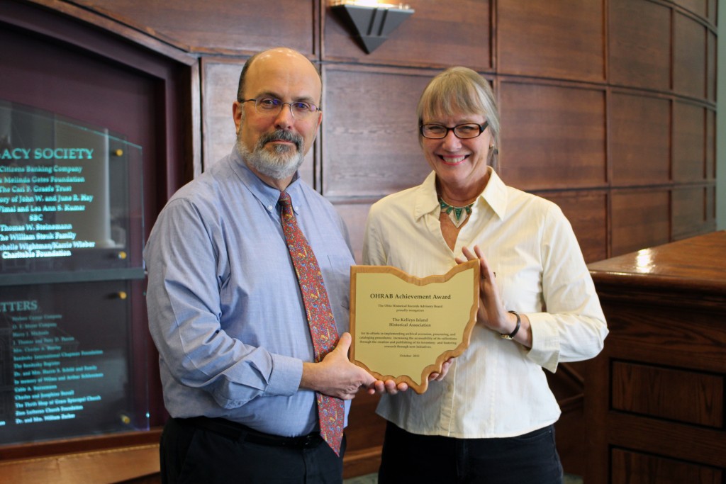 Ohio Historical Records Advisory Board member, Ron Davidson (Sandusky Library) presenting Leslie Korenko, Kelleys Island Historical Association board member, the 2015 OHRAB Achievement Award.